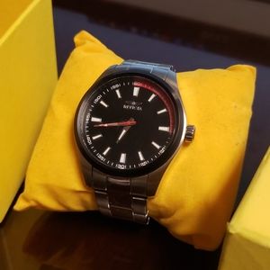 Silver Invicta wrist watch/red and black face.